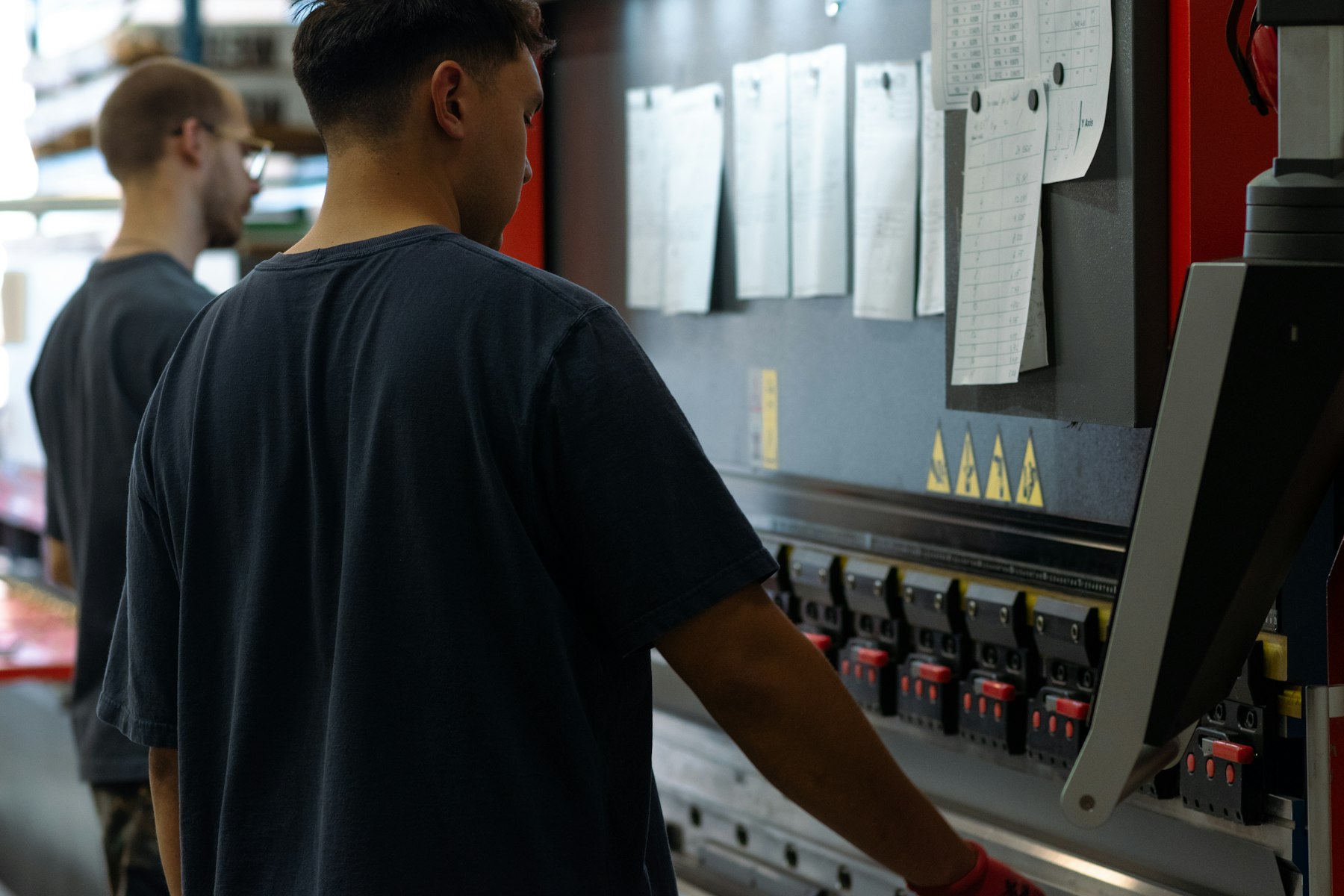Two operators at a press brake