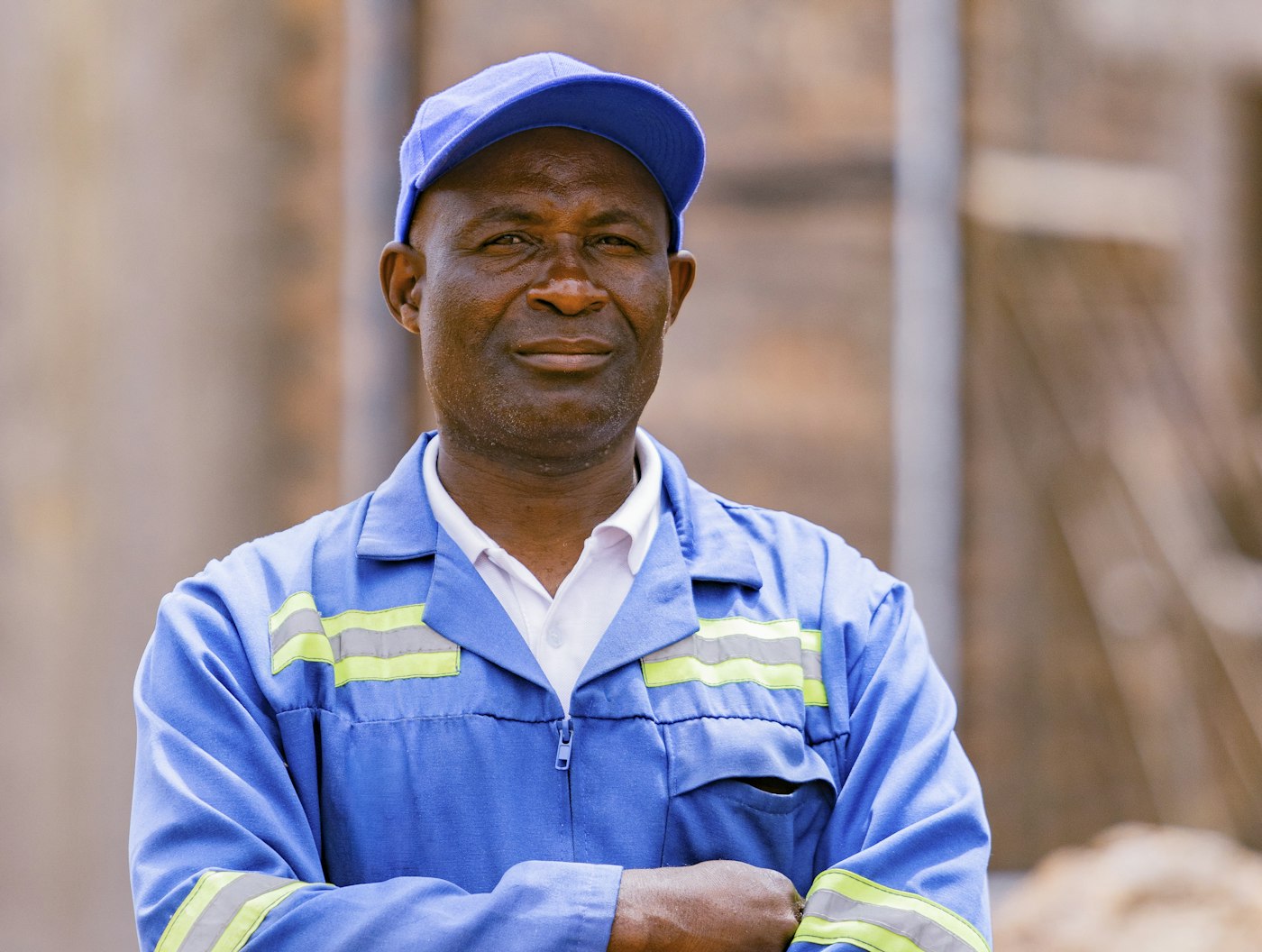 Worker in a blue uniform with reflective stripes